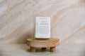 Candle melt wax bar on a wooden stand with a neutral background