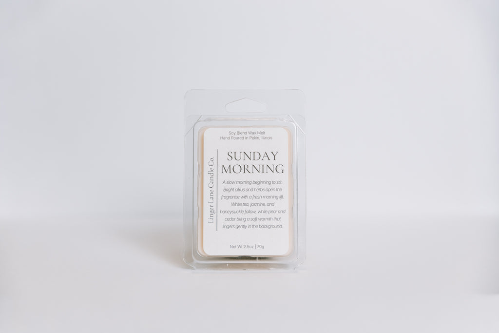 Wax melt container labeled 'Sunday Morning' on a light gray background