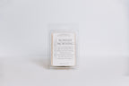 Wax melt container labeled 'Sunday Morning' on a light gray background