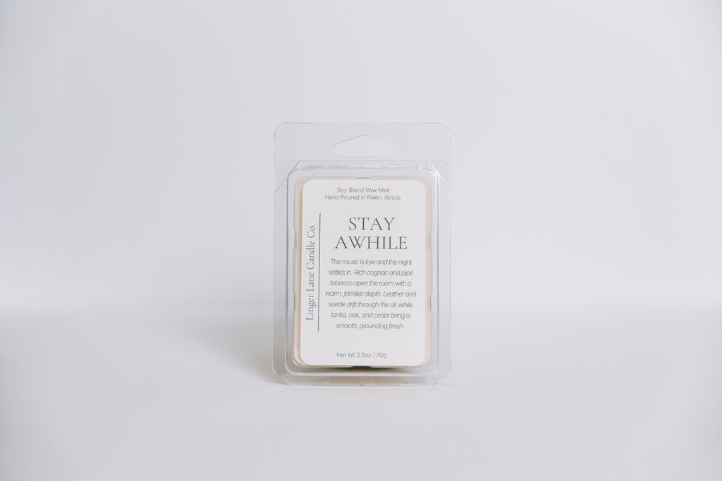 Wax melt container with 'Stay Awhile' text on a white background